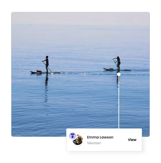 Two paddleboarders out on calm water, one of them recognised in eola as a member