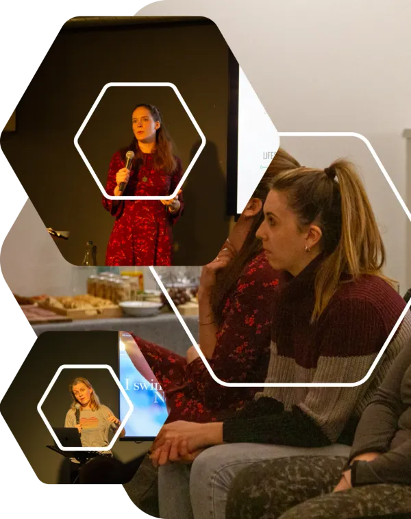 Two women speaking on stage with microphones and two women listening in the audience at eola’s International Women’s Day event, each framed in a hexagon